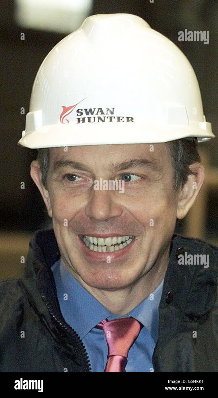 Prime Minister Tony Blair wears a safety hat during a visit, to the Swan Hunter shipyard at Tyneside. Work has begun at the yard on Ministry of Defence orders to build two vessels for the Royal Fleet Auxiliary. * ... and yard chairman Yaap Kroese said the firm, which employs more than 700 people, was in the running to increase its order book. Stock Photo
