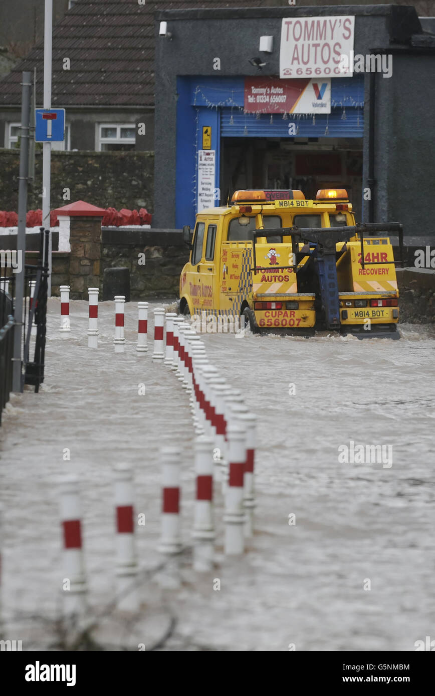 The scene at Tommy's Autos in Cupar, Scotland, after the River Eden burst its banks after continued heavy rain. Stock Photo