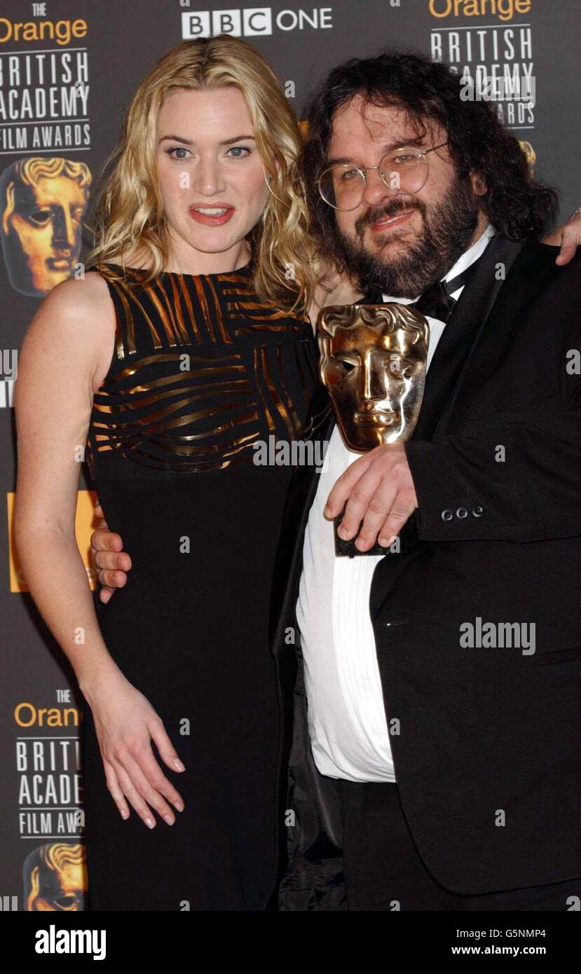 Actress Kate Winslet and Zealand director Peter Jackson with his Best Director award for Lord of Rings during the Orange British Academy Film at Odeon cinema in London's