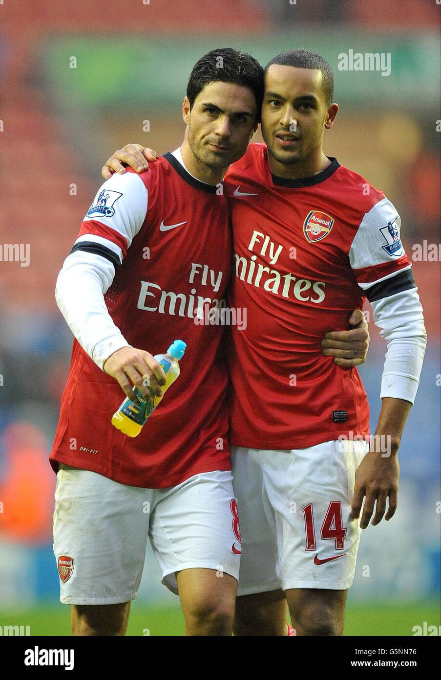 Arsenal's Mikel Arteta (left) celebrates with his team-mate Theo