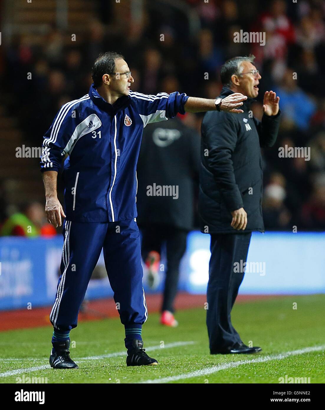 Soccer - Barclays Premier League - Southampton v Sunderland - St Mary's. Sunderland manager Martin O'Neill (left) and Southampton manager Nigel Adkins on the touchline Stock Photo