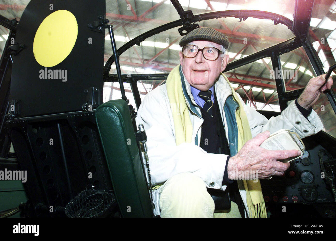 Peter George, 1st Officer with the Air Transport Auxiliary, sits in the cockpit of a Lancaster Bomber during celebrations to mark the 60th anniversary of the plane's 2nd World War missions, at Duxford Air Museum, Cambridgeshire. * RAF veterans criticised the Ministry of Defence's failure to recognise the achievements of Bomber Command, feeling that campaign medals should have been awarded to the crews despite the controversy caused by the number of civilians killed during the bombing raids over Germany, which are seen as a vital contribution to the Allied victory. Stock Photo