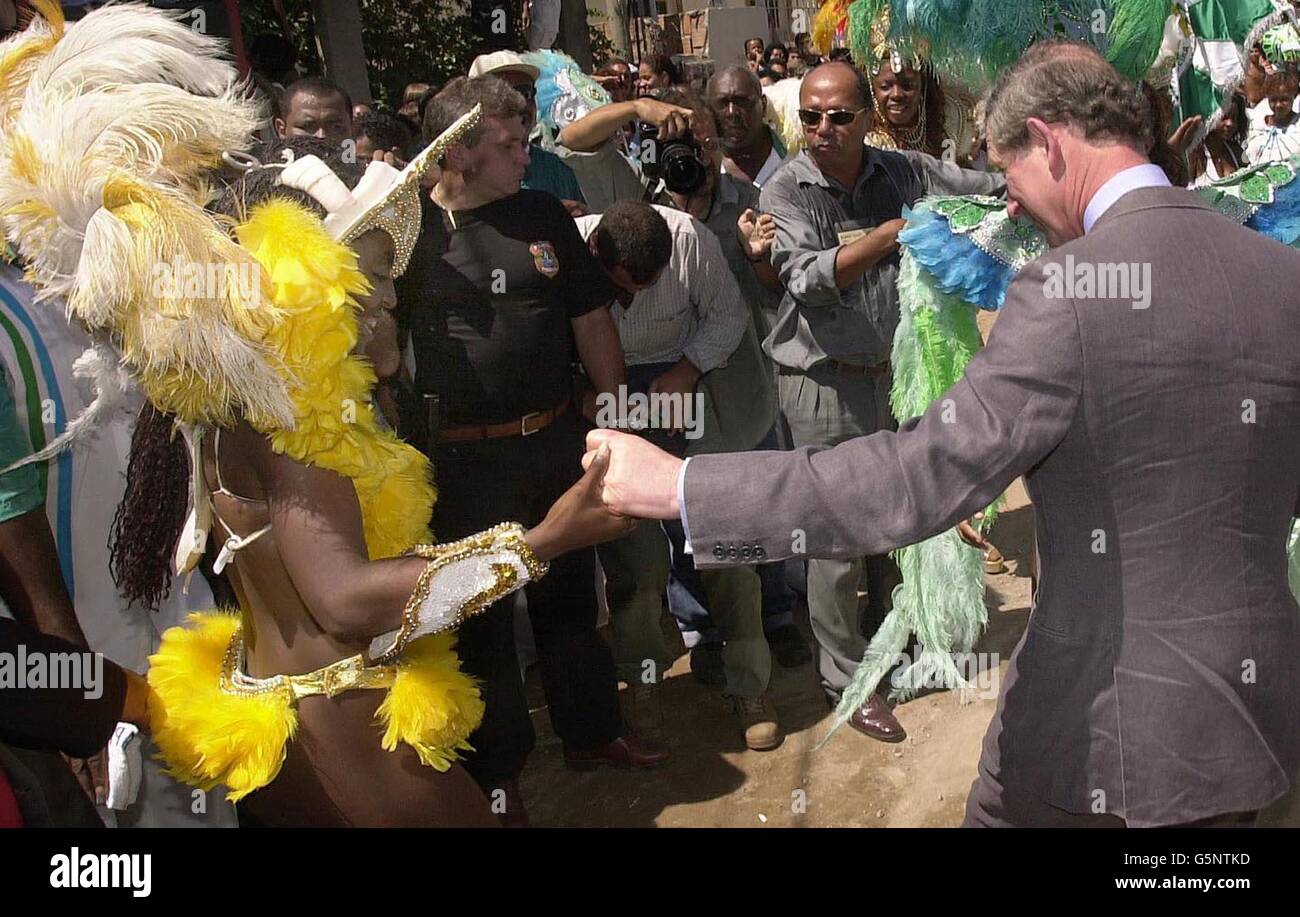 The Prince of Wales joins samba dancers at the Casa da Cultura, a centre run by the charity ActionAid in the Baixada Fluminense slum on the outskirts of Rio de Janiero, Brazil, on the second day of his tour of Brazil and Mexico. Stock Photo