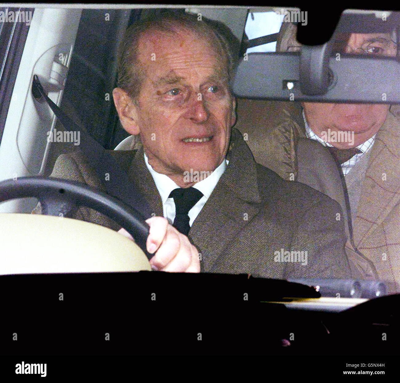 The Duke of Edinburgh drives from Sandringham Parish Church after attending morning service the day after the death of 71 year-old Princess Margaret - the sister of Britain's Queen Elizabeth II. Stock Photo
