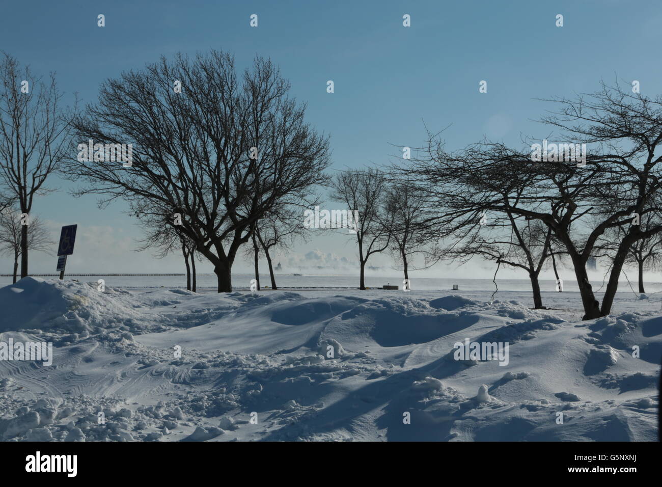 Snow covers the ground of a park by Lake Michigan in Milwaukee, Wisconsin in 2014 winter. Stock Photo