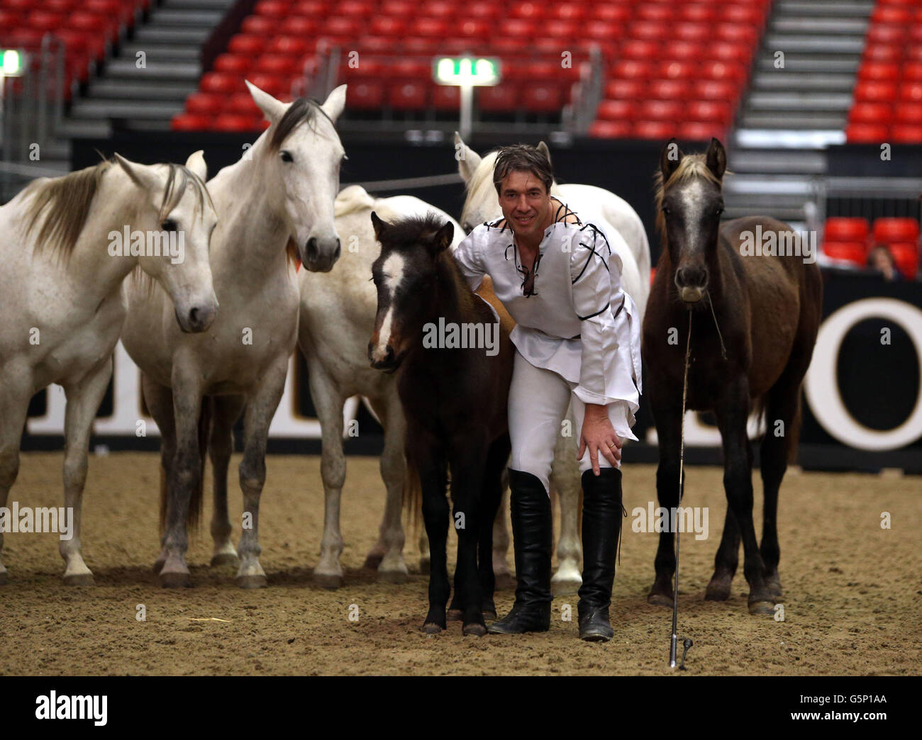 Jean-Francois Pignon kicks off celebrating 40 years of world class equestrian sport with a display of his horsemanship during day one of The London International Horse Show at the London Olympia, London. Stock Photo