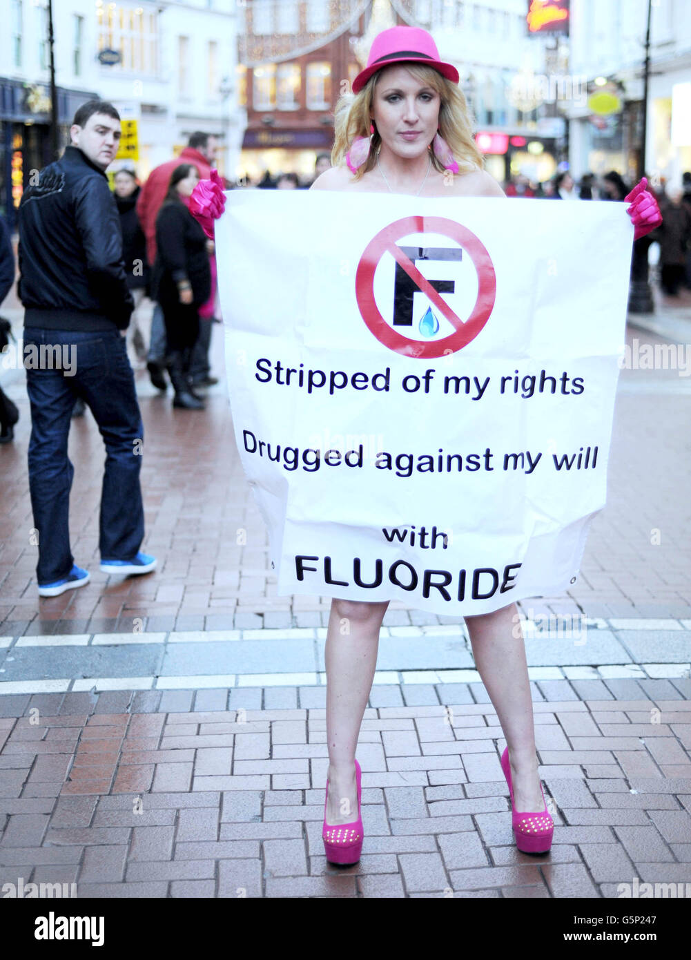 Aisling Fitzgibbon, also known as 'The Girl Against Fluoride', strips off on Grafton Street in Dublin today. PRESS ASSOCIATION Photo Fitzgibbon is taking a legal case against the Irish government to prevent it from adding chemicals such as fluoride to the water supply until they have been proven safe for human consumption. Picture date: Wednesday December 19, 2012 Photo credit should read: Niall Carson/PA Wire Stock Photo
