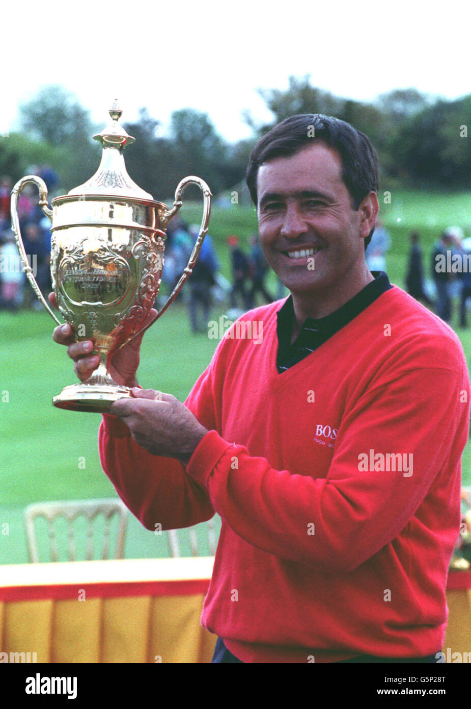 Severiano Ballesteros hold the Benson and Hedges International Open trophy at St Mellion. Stock Photo