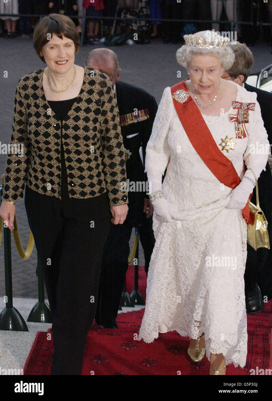 Britain's Queen Elizabeth II (right) and New Zealand Prime Minister Helen Clark arrive at Parliament House, Wellington, New Zealand for a State Dinner during a visit to the country during a visit to the country. * In a keynote speech at the dinner, the Queen said it had been a privilege and a pleasure to serve as the country's head of state for the past 50 years and said she looked foreword to continuing to serve to the best of her ability in the years to come. Stock Photo