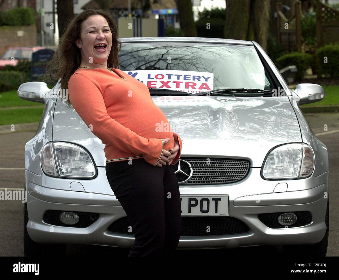 Expectant mum from Luton, Susan Martin, 30, by a top of the range Mercedes SLK she hopes buy, after winning the 4,744,343 jackpot prize in Saturday's Lottery Extra draw. Susan Martin said she and her partner, Steven Hughes, 39, * have postponed a dream holiday in Hawaii until her second child, due in May, has been born. Stock Photo