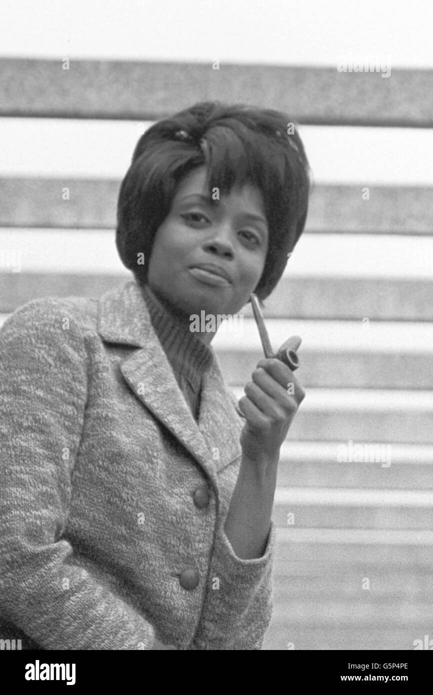 American R&B soul singer Fontella Bass smokes a pipe during a promotional trip to London. Stock Photo
