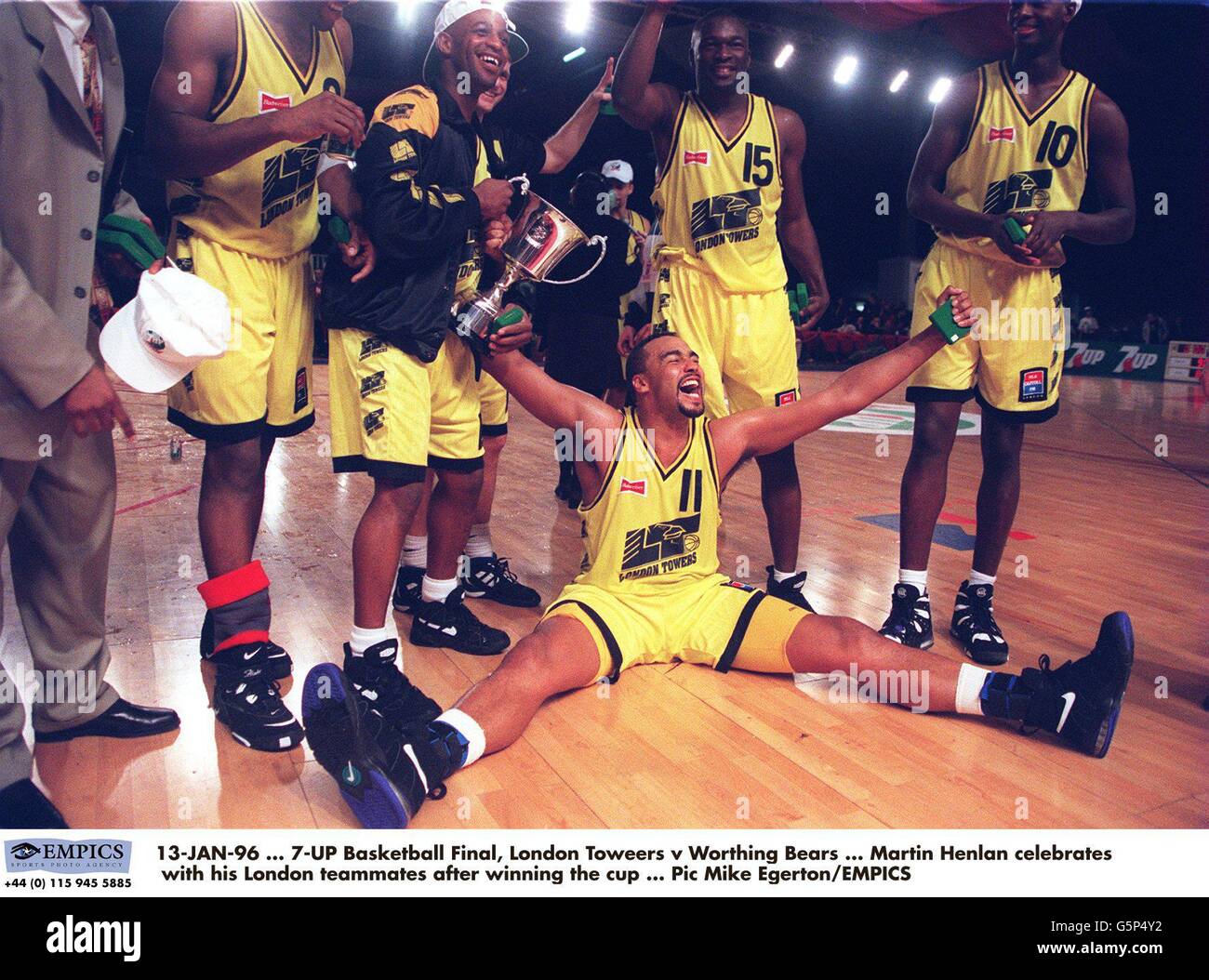 13-JAN-96, 7-UP Basketball Final, London Toweers v Worthing Bears, Martin Henlan celebrates with his London teammates after winning the cup Stock Photo