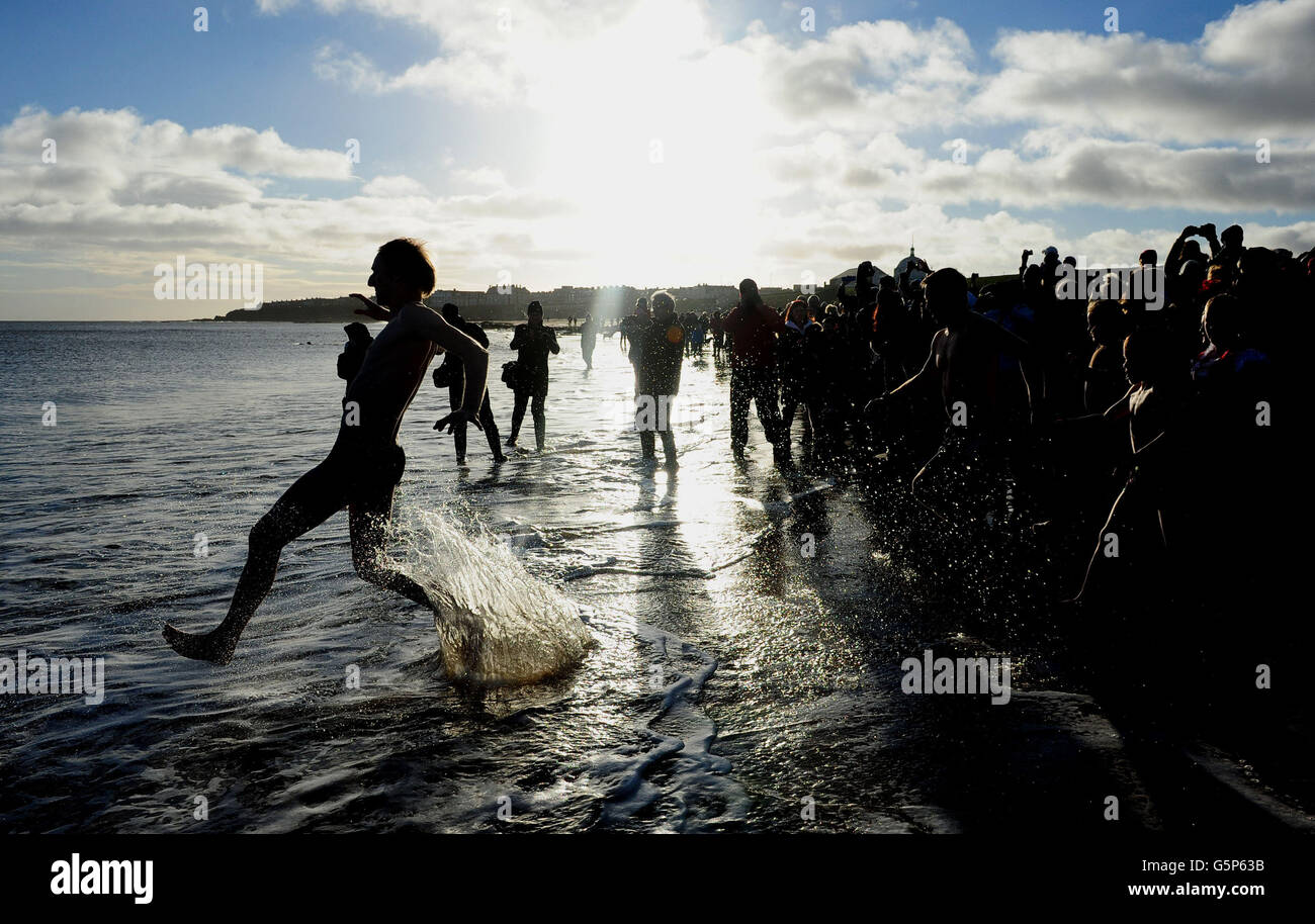 Swimmers take part in the New Years Day Dip at Whitley Bay in North ...