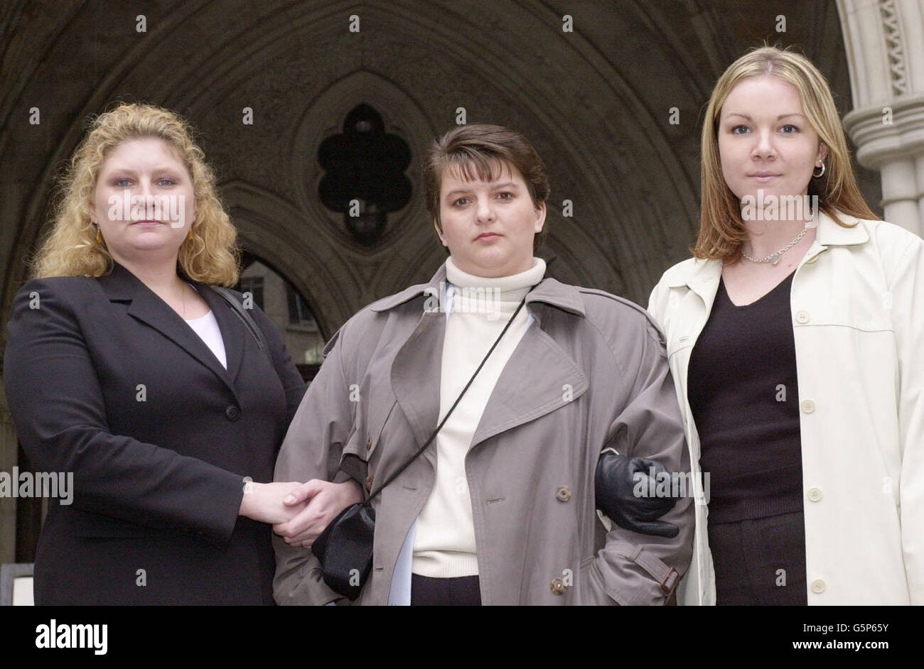 From left - Penny Cockings from Yeovil in Somerset, Trudi Banning from Leamington Spa and Michelle Markey from Reading, stand outside the High Court, as a case against Schering Healthcare involving around 100 women, * who claim that they were exposed to potentially lethal side-effects by using the third generation contraceptive pill begins. The case is the first major group action involving the application of the Consumer Protection Act to a pharmaceutical product where it is alleged that the product 'Femodene' which appeared in 1987, carried an increased risk of danger to the user of which Stock Photo