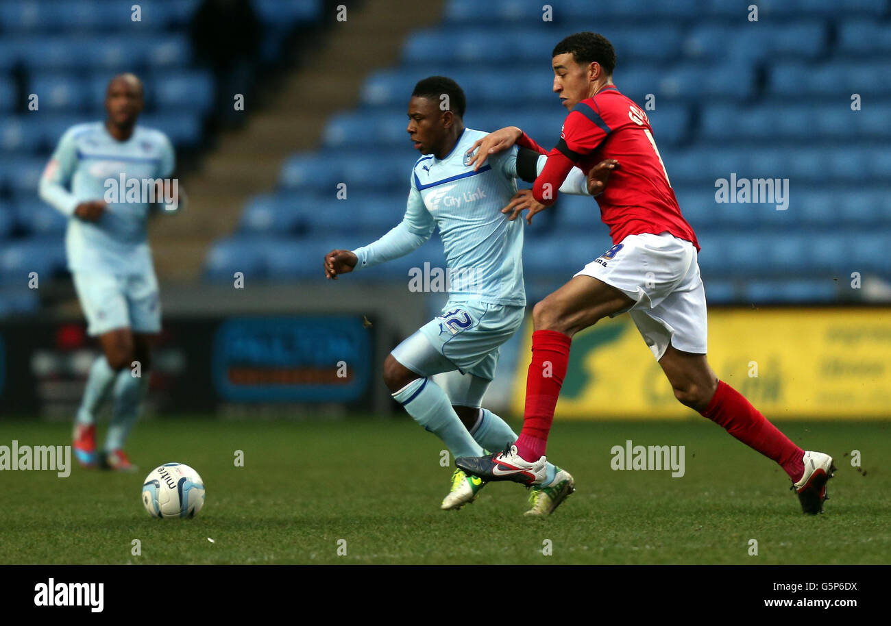 Coventry's Franck Moussa gets away from Shrewsbury's Connor Goldson (right) during the npower League One match at the Ricoh Arena, Coventry. Stock Photo