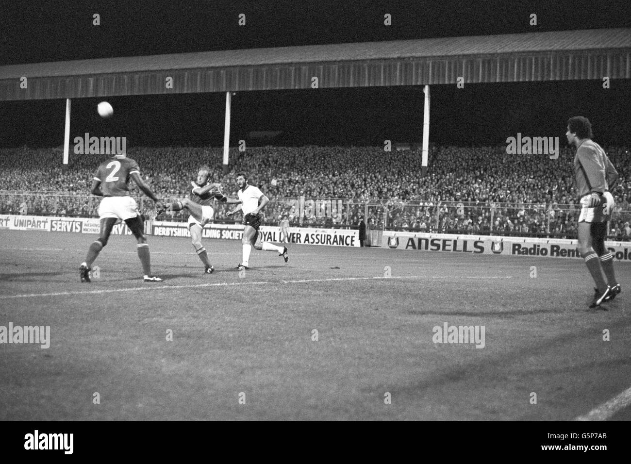 Nottingham Forest's Archie Gemmill (centre) clears a Liverpool attack during a European Cup first-round match at the City Ground, watched by Forest goalkeeper Peter Shilton (r). Stock Photo