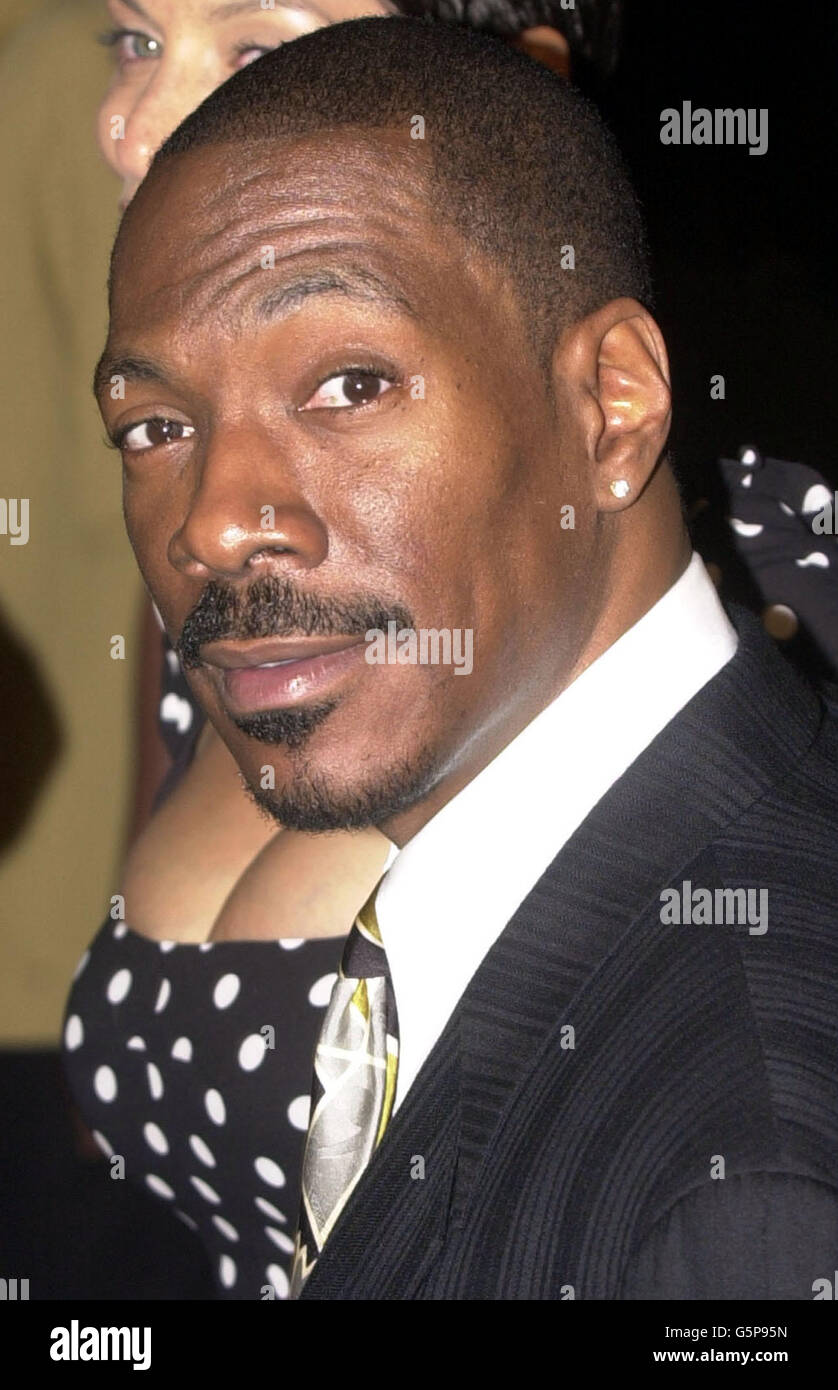Eddie Murphy with wife Nicole arrives to the premiere of Showtime at the Grauman's Chinese theatre in Hollywood. Stock Photo