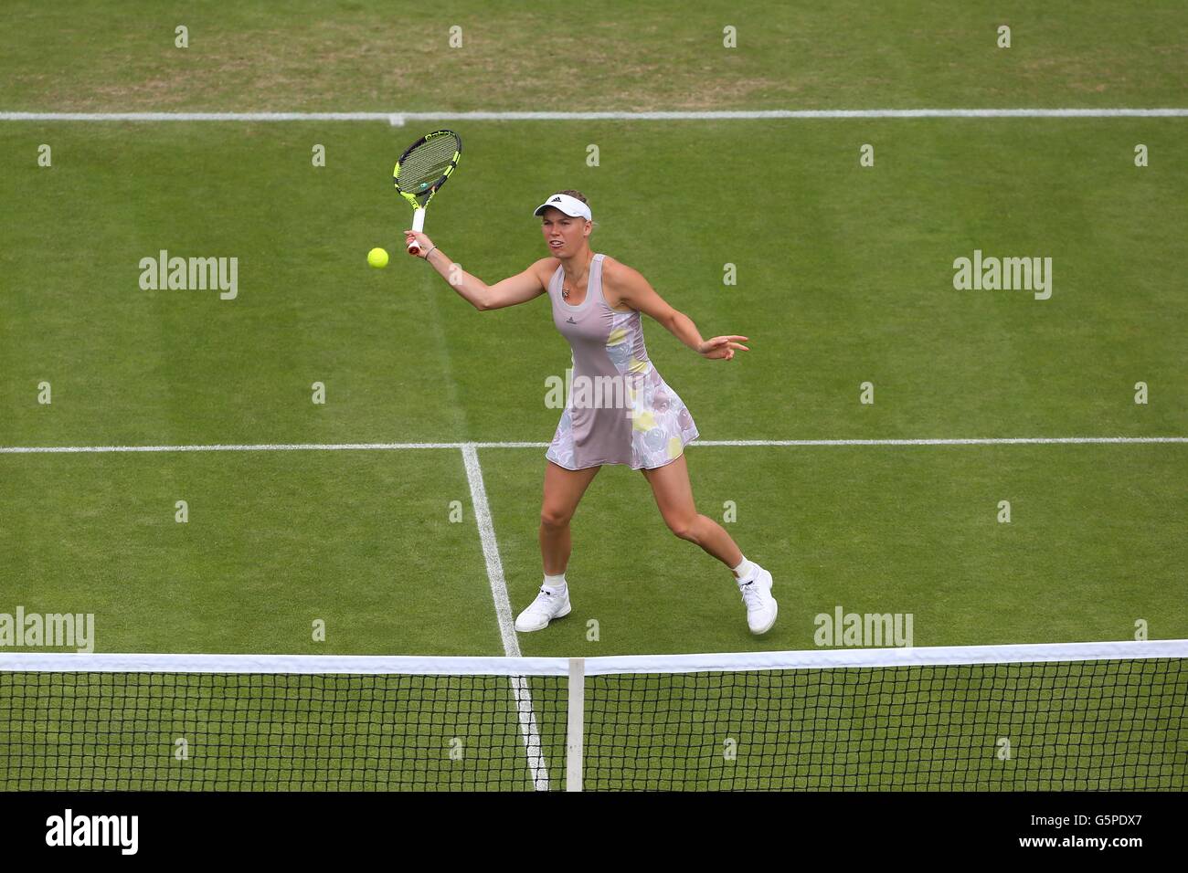 Eastbourne, UK. 22nd June, 2016.  Denmark's Caroline Wozniack in action against Monica Puig of  Puerto Rico at the Aegon International Eastbourne Tennis Tournament Credit:  James Boardman /Alamy Live News Stock Photo