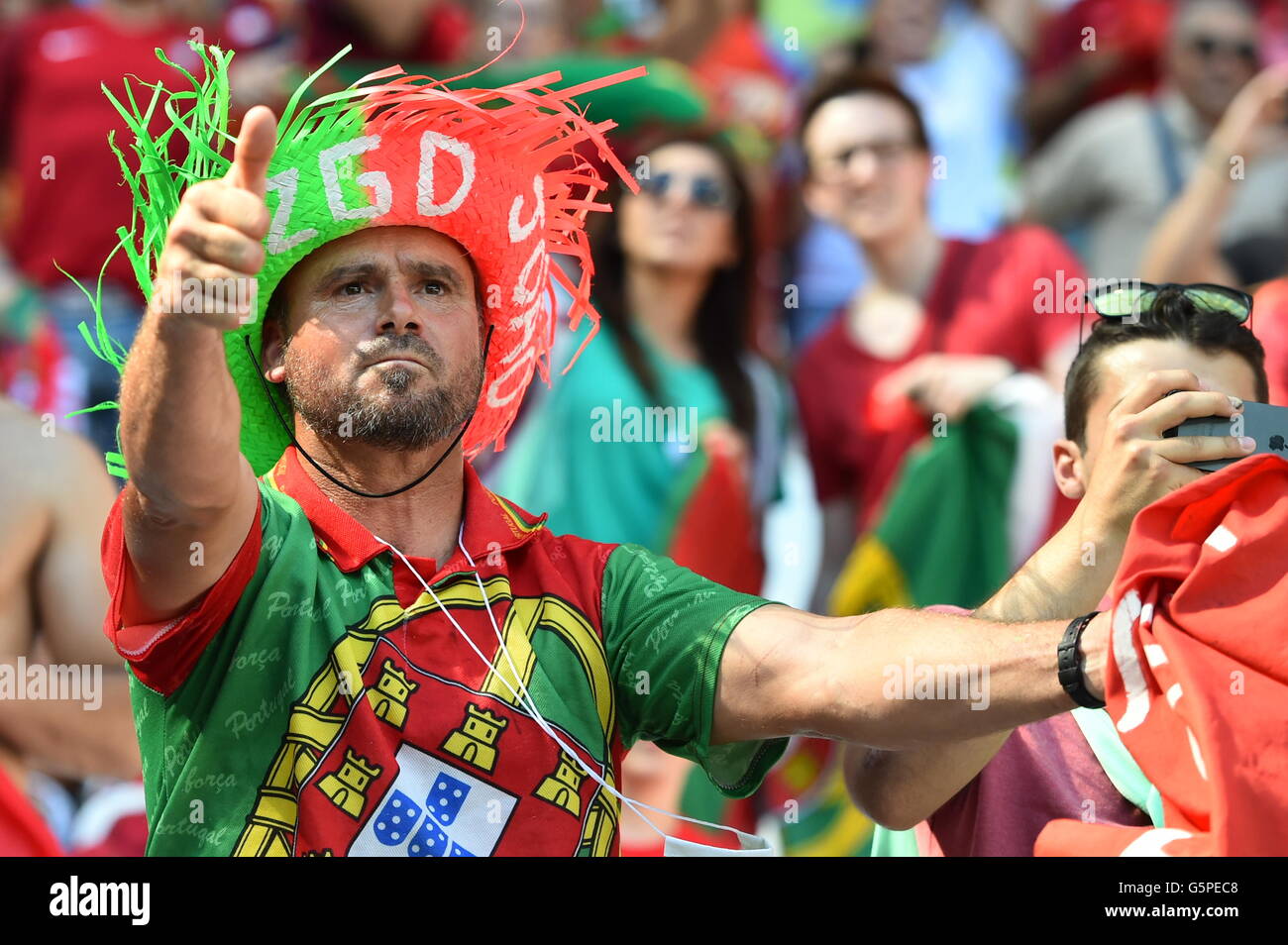Lyon, France. 22nd June, 2016. Supporters of Portugal cheer prior to the UEFA Euro 2016 Group F soccer match between Hungary and Portugal at the Stade de Lyon in Lyon, France, 22 June 2016. Photo: Uwe Anspach/dpa/Alamy Live News Stock Photo