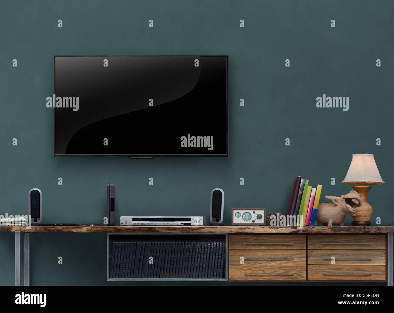 led tv on dark blue wall wooden media furniture in living room Stock