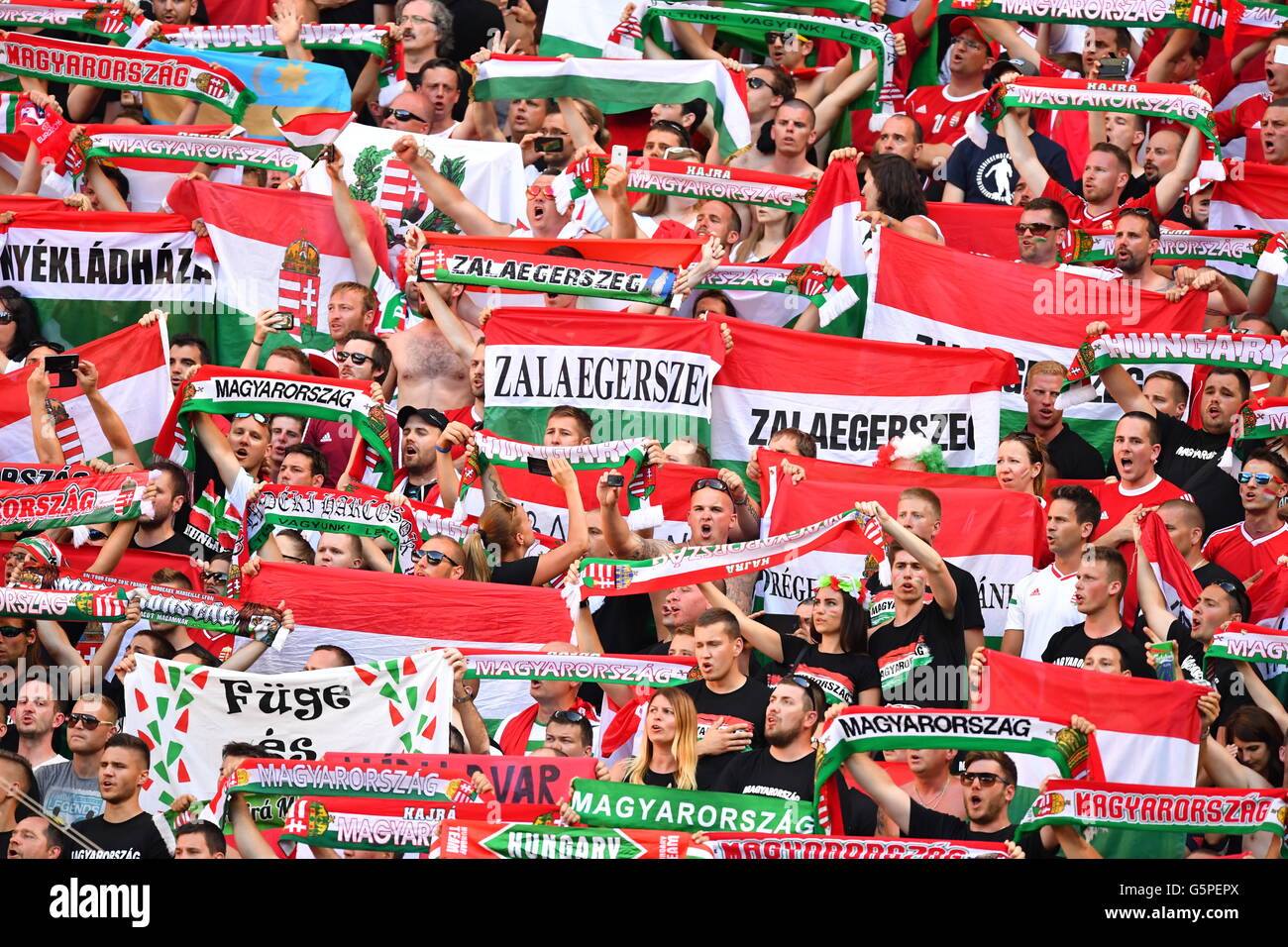 Lyon, France. 22nd June, 2016. Supporters of Hungary cheer for their team prior to the UEFA Euro 2016 Group F soccer match between Hungary and Portugal at the Stade de Lyon in Lyon, France, 22 June 2016. Photo: Uwe Anspach/dpa/Alamy Live News Stock Photo