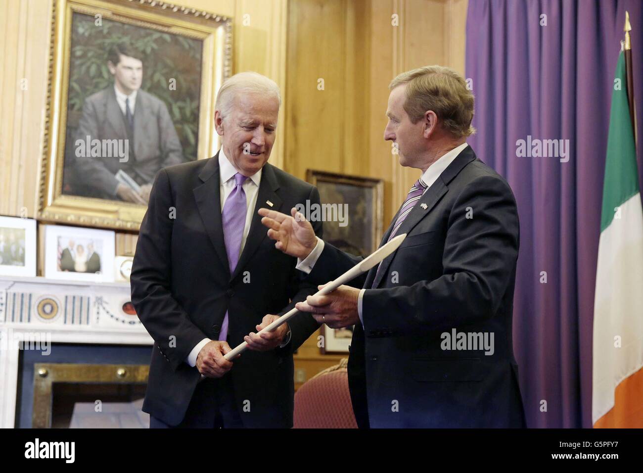 U.S. Vice President Joe Biden is given a cricket bat by Taoiseach Enda Kenny before their bilateral meeting at the government building June 21, 2016 in Dublin, Ireland. Stock Photo