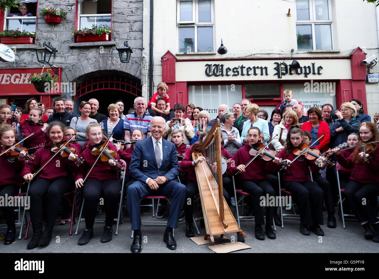 U.S. Vice President Joe Biden poses with members of the local traditional band, Rolling Wave during a visit to his ancestral home June 22, 2016 in Castlebar, County Mayo, Ireland. Stock Photo