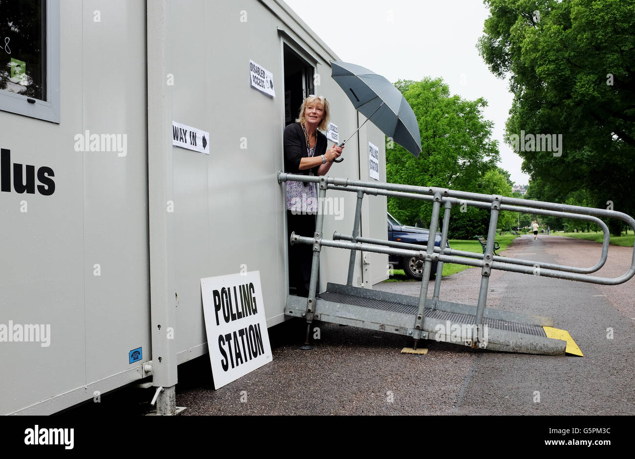 Brighton, UK. 23rd June, 2016. Staff keep an eye on the weather outside the ble polling station in the Preston Park area of Brighton this morning as Britain votes whether to remain in or leave the European Union   Credit:  Simon Dack/Alamy Live News Stock Photo
