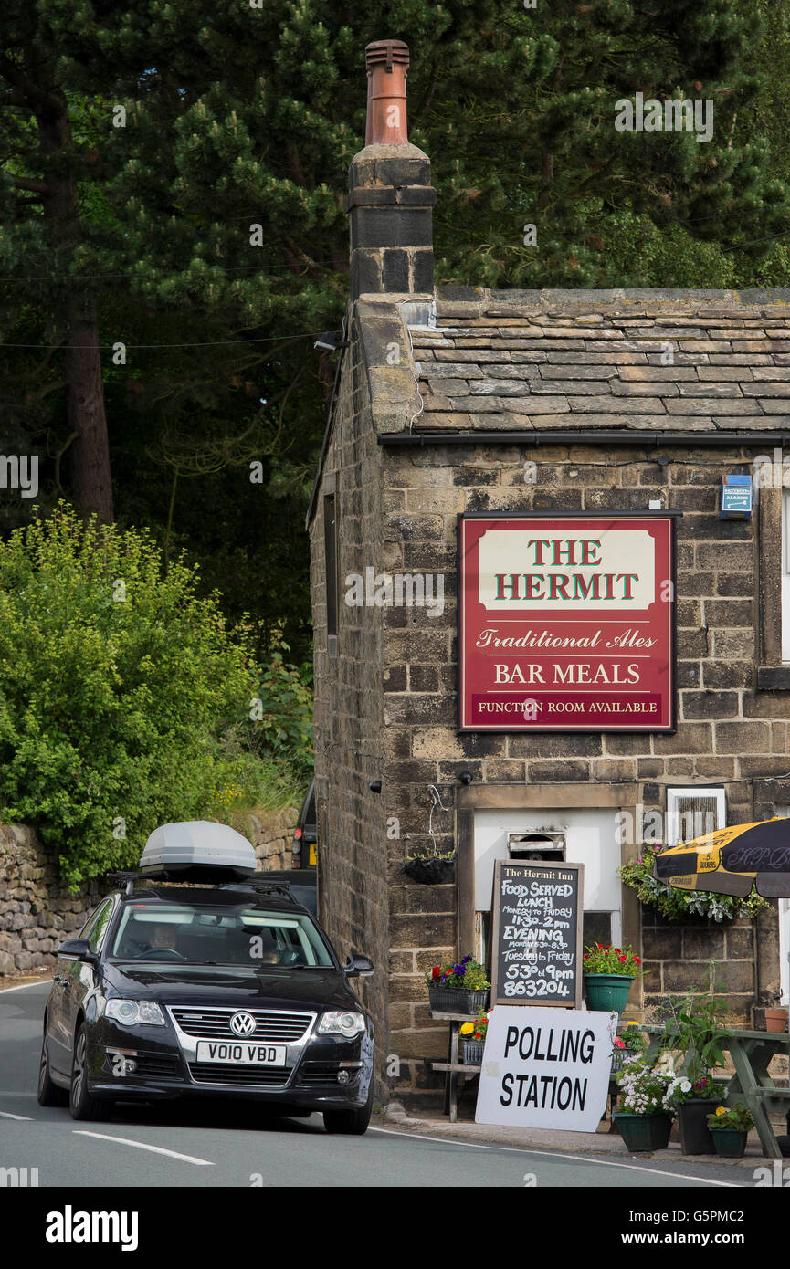 Burley Woodhead, West Yorkshire, Britain. 23rd June, 2016. Election day. Car passes a village pub used as an EU Referendum Polling Station Credit:  Ian Lamond/Alamy Live News Stock Photo