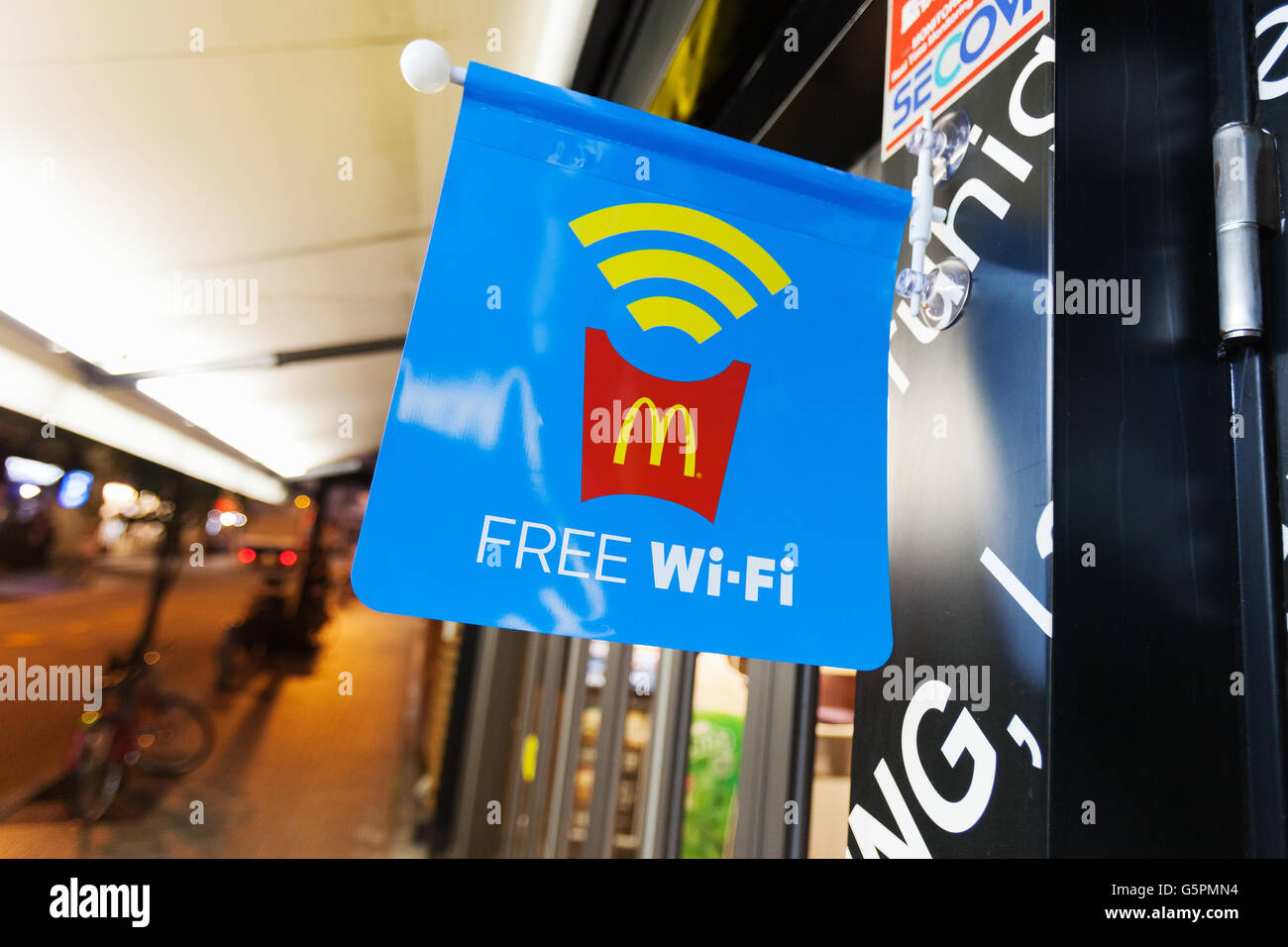 Free wi-fi access promoted outside McDonald's Azabujuban branch on June 23, 2016, Tokyo, Japan. McDonald's Japan launched the service on June 20th and announced that it will provide free wi-fi in some 1,500 branches across Japan by the end of July. © Rodrigo Reyes Marin/AFLO/Alamy Live News Stock Photo