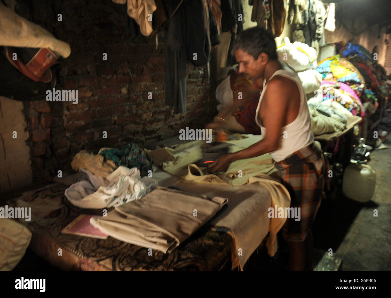 Washers, known locally as Dhobis, work in the open to wash clothes from Mumbai's households
