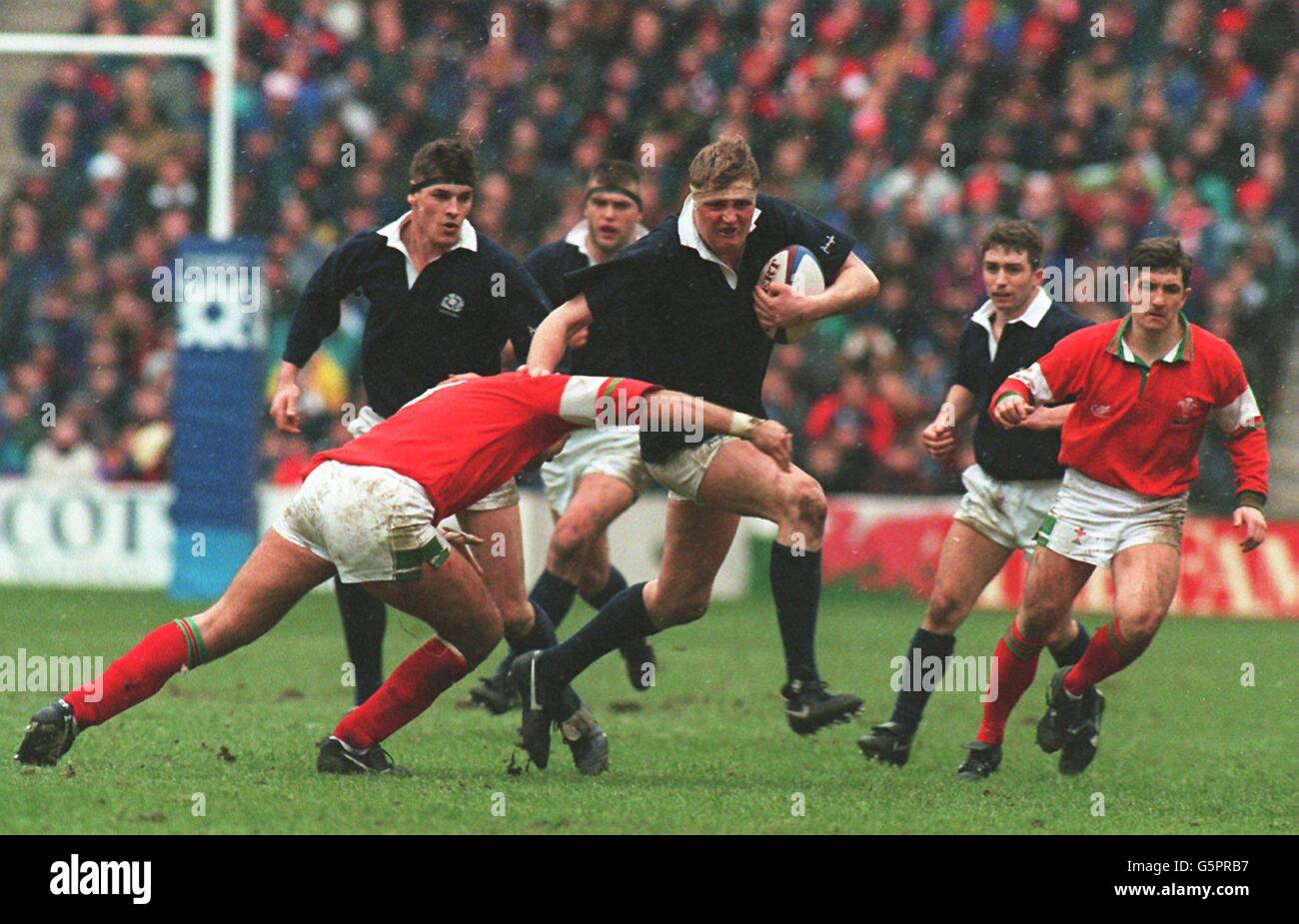 5 Nations Rugby Union. Stewart Campbell, Scotland, is tackled by