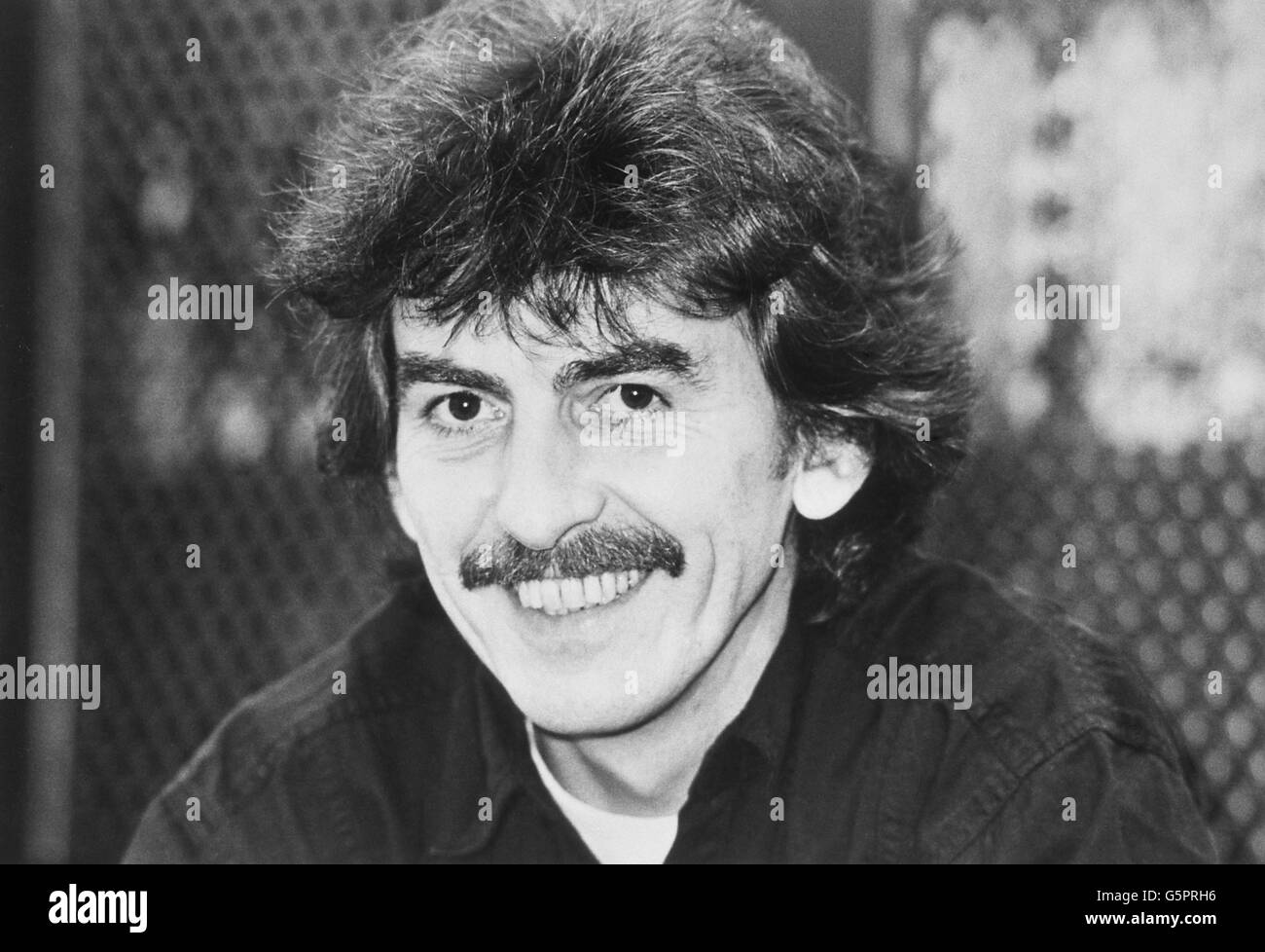 George Harrison, 41, the former Beatles star, now an executive producer of Handmade Films, which was founded in 1978. George is a co-producer of Handmade Films along with American financier Dennis O'Brien. Formerly married to model Patti Boyd, from whom he split in 1974, George now lives in a mansion near Henley, Oxford, with his Mexican-born wife Olivia, 35, and five-year-old son Dhani, while travelling to and from Handmade headquarters in Cadogan Square, London. Stock Photo