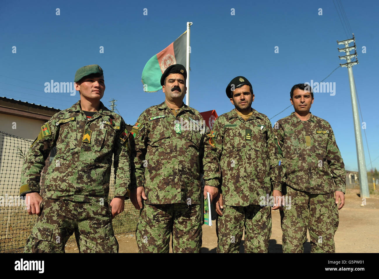 (left to right) Counter insurgency officers Sergeant Baryalai, Lieutenant Colonel Mohammad Nasim, Captain Framoos and Sergeant Karwan of the Afghan National Army after handing out certificates at a mortar course graduation at Shorobak training centre, Helmand Province, Afghanistan. Stock Photo