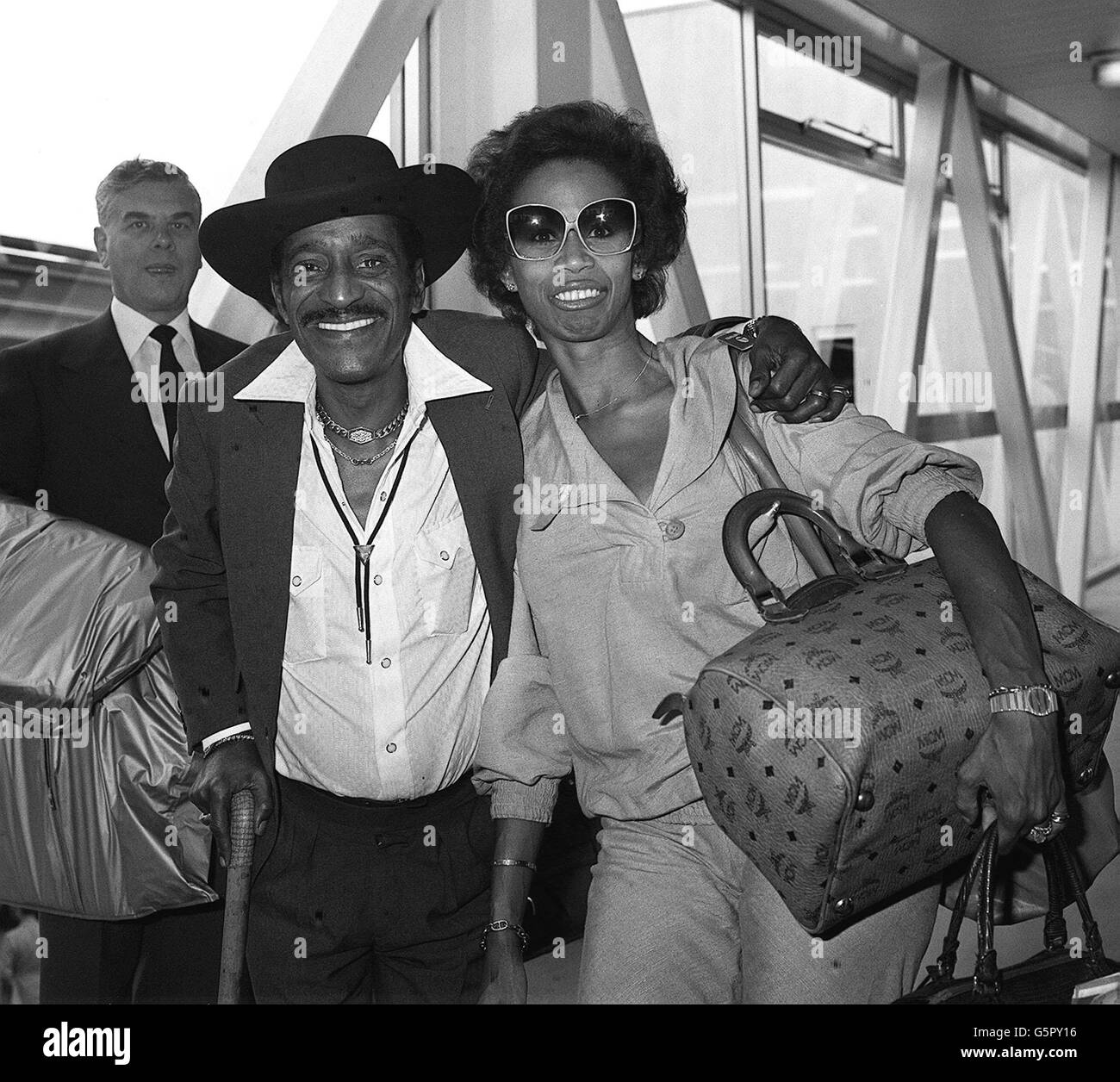 American entertainer Sammy Davis Junior, and his wife, Altovise, at London's Heathrow airport when they rrived from New York. He is here for eight London concerts, including a charity show in aid of Tel Aviv university. Stock Photo