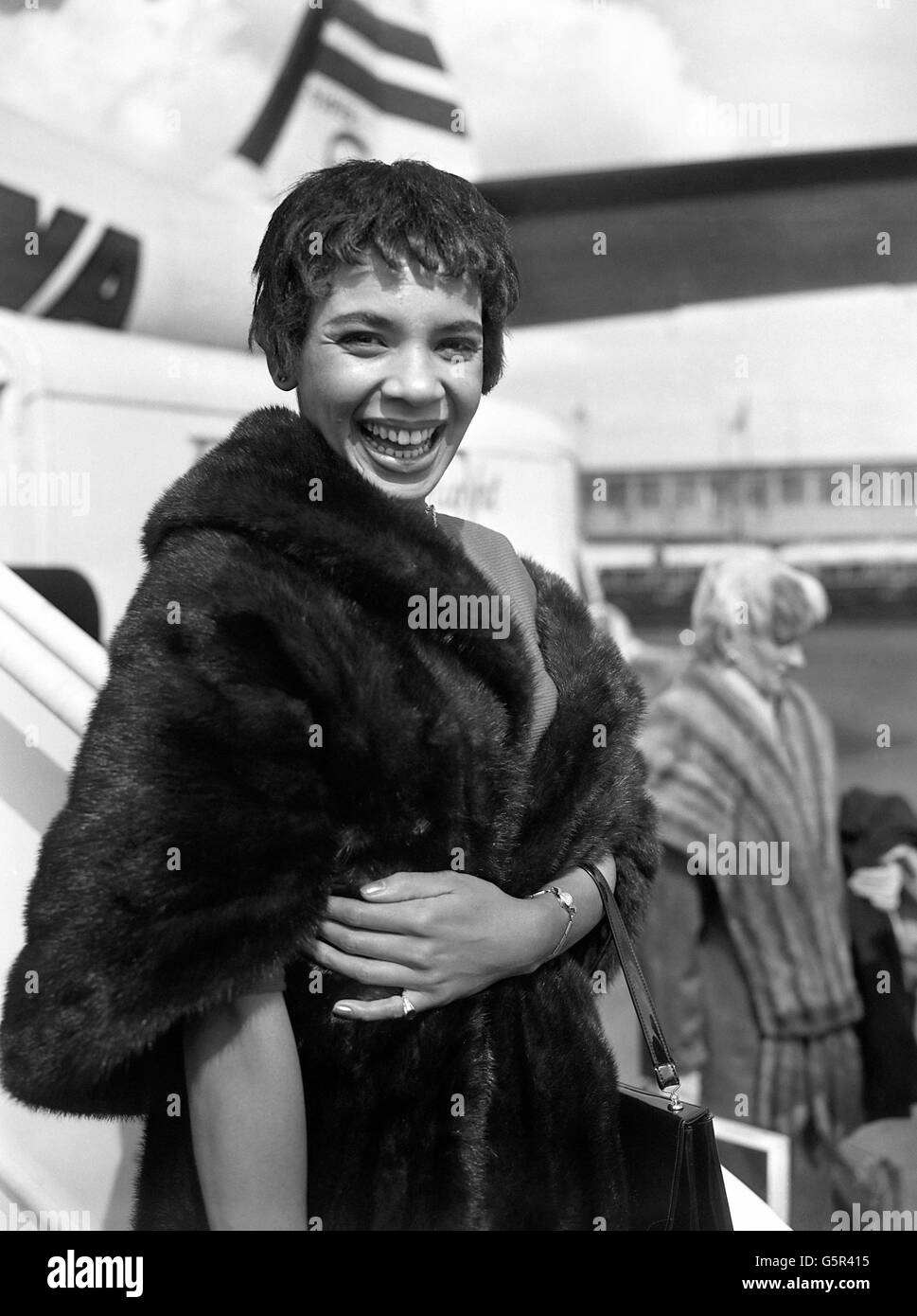 Cabaret star Shirley Bassey, who wears a new hair style, arriving at London airport from New York. Stock Photo