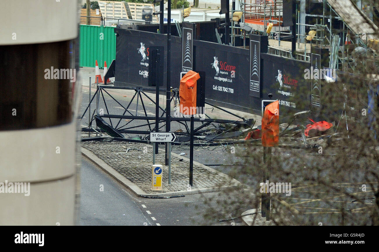 A section of the Crane lays in Nine Elms Lane, after crashing to the ground close to St George's Wharf tower building, where a Helicopter crashed into this morning, in Vauxhall south London. Stock Photo