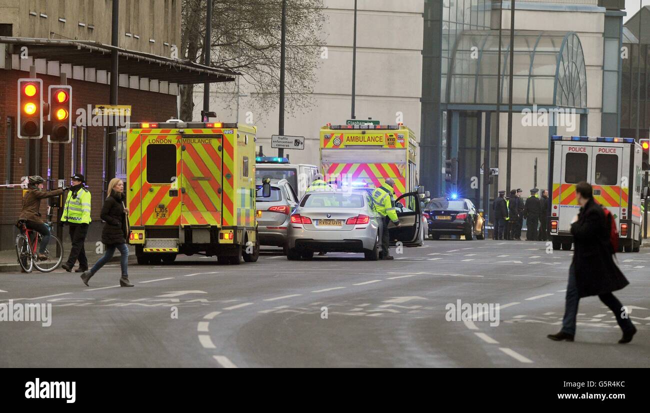Police close off the junction of Parry Street and Wandsworth Road, after a helicopter crashed into the Crane on top of St George's Wharf tower building, in heavy freezing mist in Vauxhall south London. Stock Photo