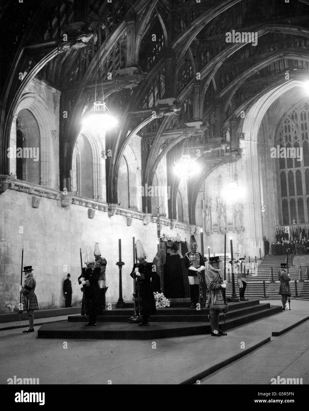 The coffin of King George VI rests on a purple-drapes catafalque lying in state at Westminster Hall, London. Stock Photo