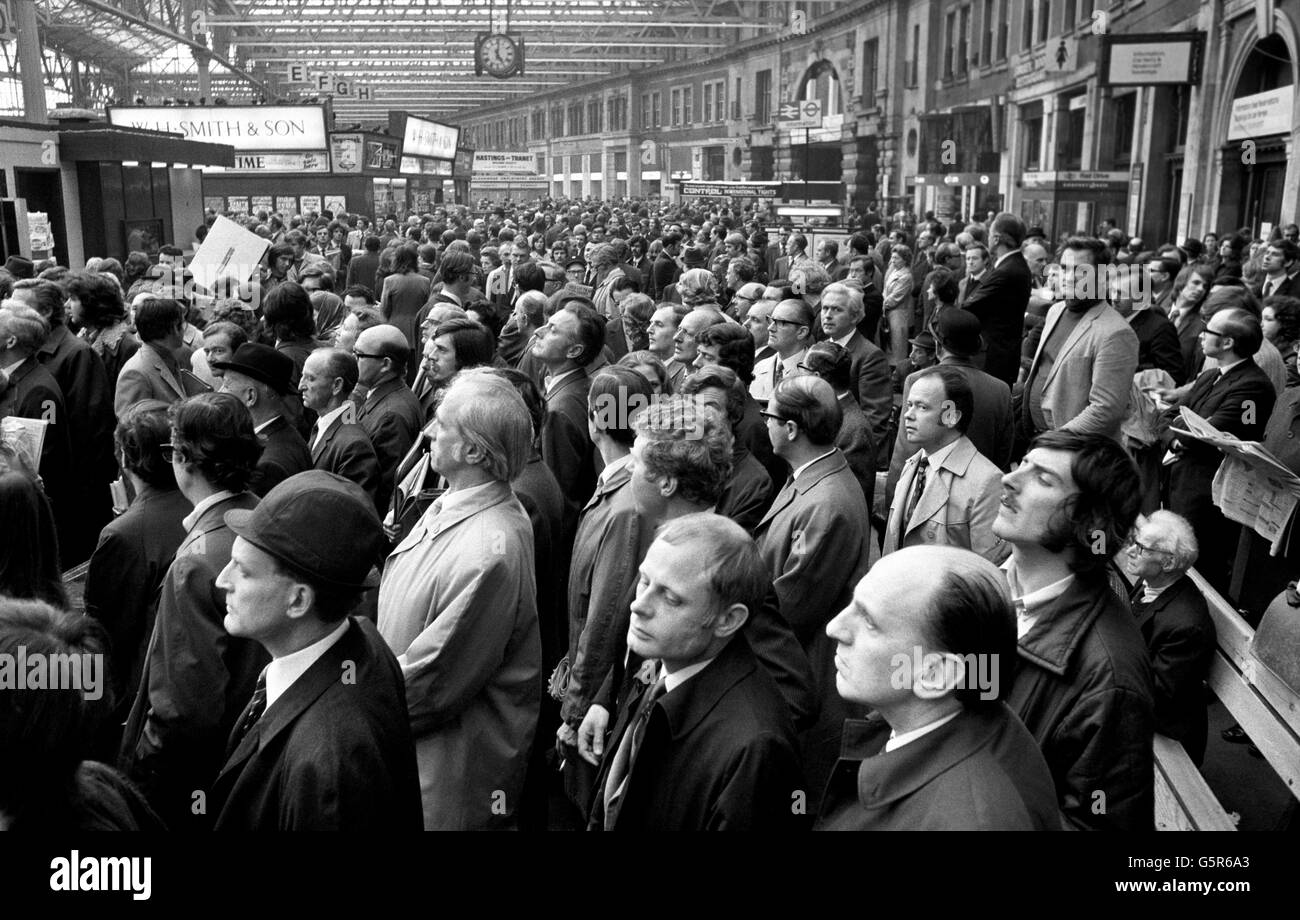 A grim but patient look on the faces of would-be passengers at Waterloo Station as they wait for trains home during rush hour. Stock Photo