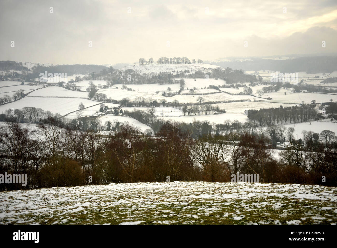 Snow covers the landscape around Cam Long Down near Dursley