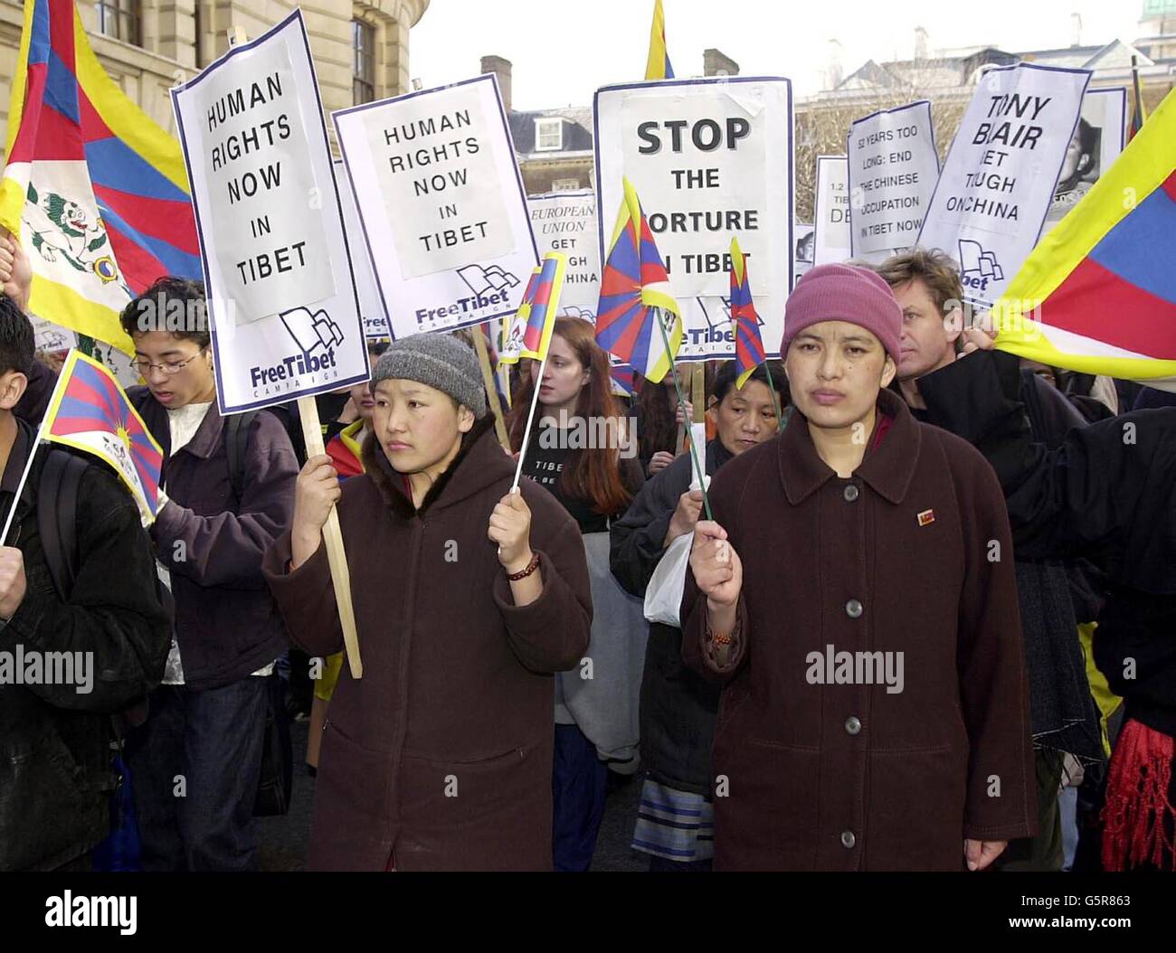 Tibetan nuns, Passang Lhamo (left) and Chuye Kunsang taking part in a freedom march in central London, to commemorate the Tibetan National Uprising of 1959 against the Chinese occupation. Stock Photo