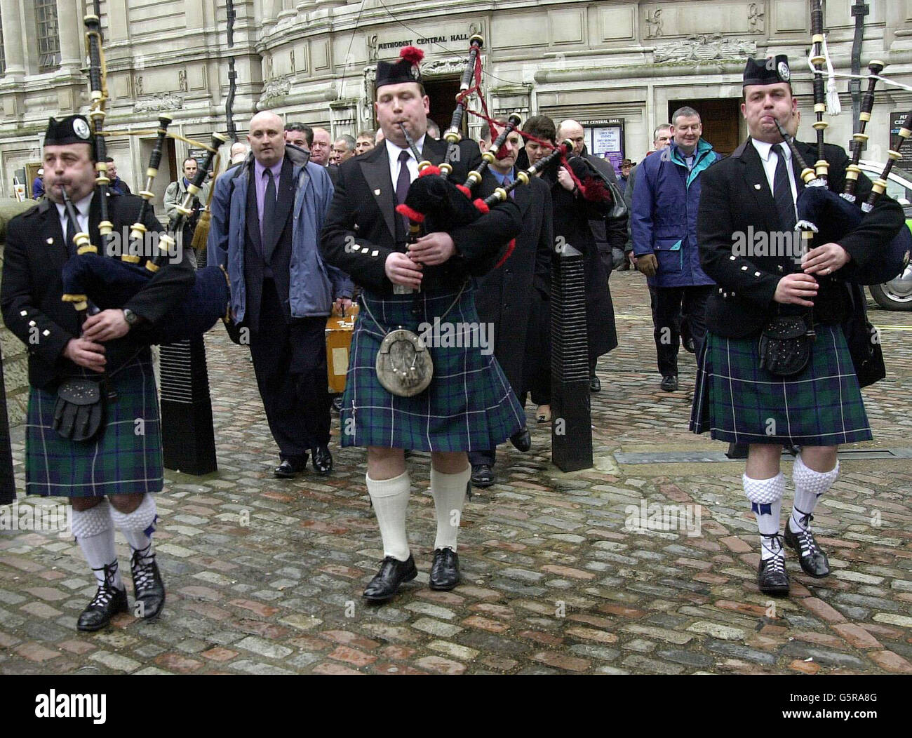 Scottish police officers from forces in Strathclyde and Dumfries & Galloway are led by three pipers, Steven Kinvig (left), Callum Watson, and Euan Grierson (right), to a mass lobby in Westminster, London. * ... Police officers are protesting over pay and proposed government reforms to the police force. Stock Photo
