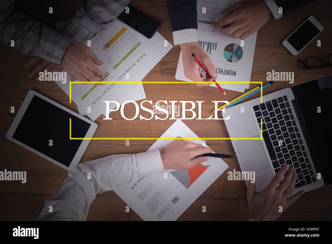 BUSINESS TEAM WORKING OFFICE  Possible TEAMWORK BRAINSTORMING CONCEPT Stock Photo