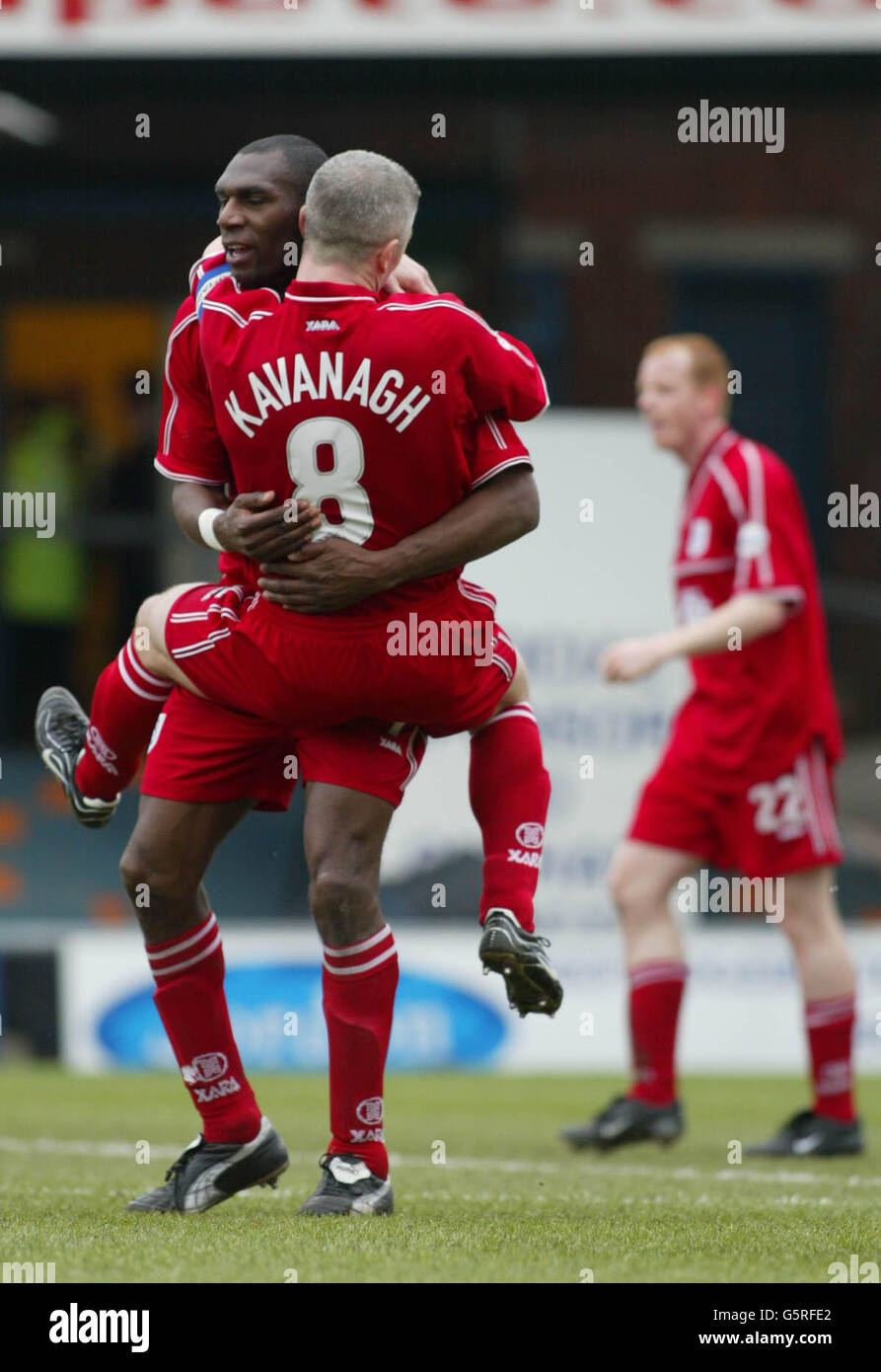 Cardiff's Leo Fortune-West is congratulted by team mate Graham Kavanagh ...