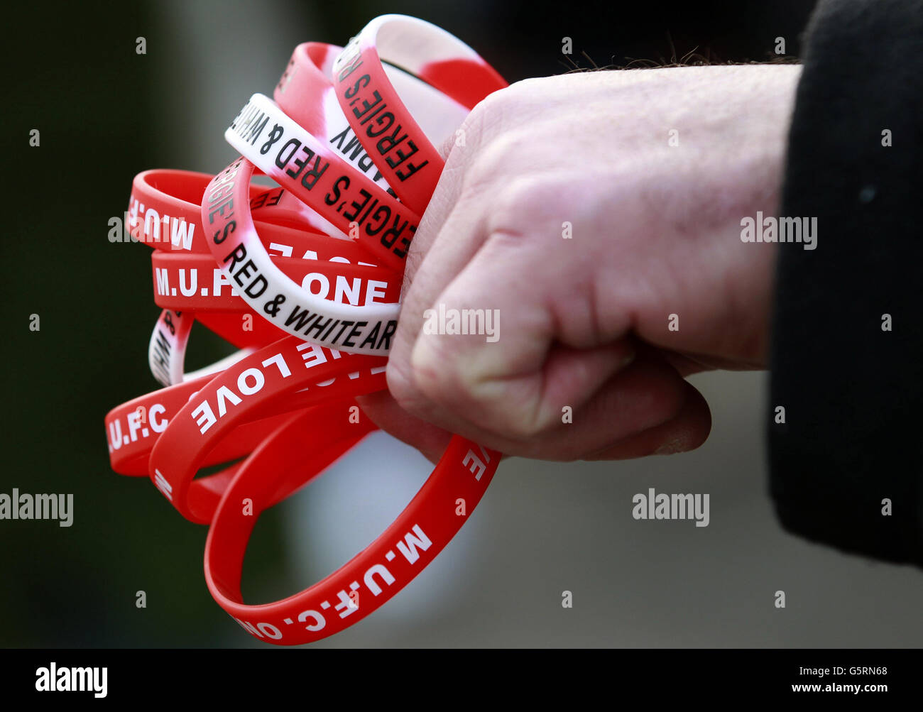 A man sells Manchester United wristbands ahead of the Barclays