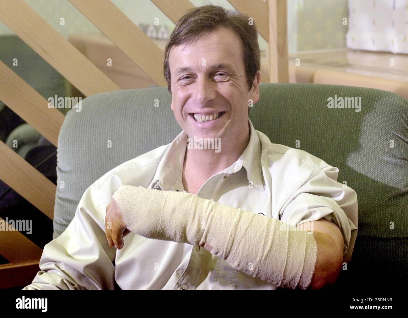 Professor Kevin Warwick at Oxford's Radcliffe Infirmary (Hospital) after his operation to place a mirochip in his arm. Surgeons have carried out a ground-breaking operation on a cybernetics professor so that his nervous system can be wired up to a computer. * Professor Kevin Warwick, the world's first cyborg part human, part machine hopes that readings can now be taken from the implant in his arm of electrical impulses coursing through his nerves. These signals, encoding movements like wiggling fingers and feelings like shock and pain, will be transmitted to a computer and recorded for the Stock Photo