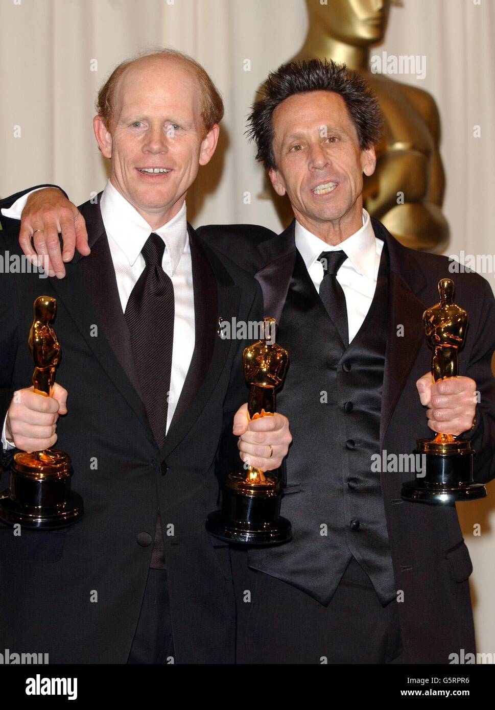Ron Howard (left) with his Best Director and Best Film Oscars and Brian