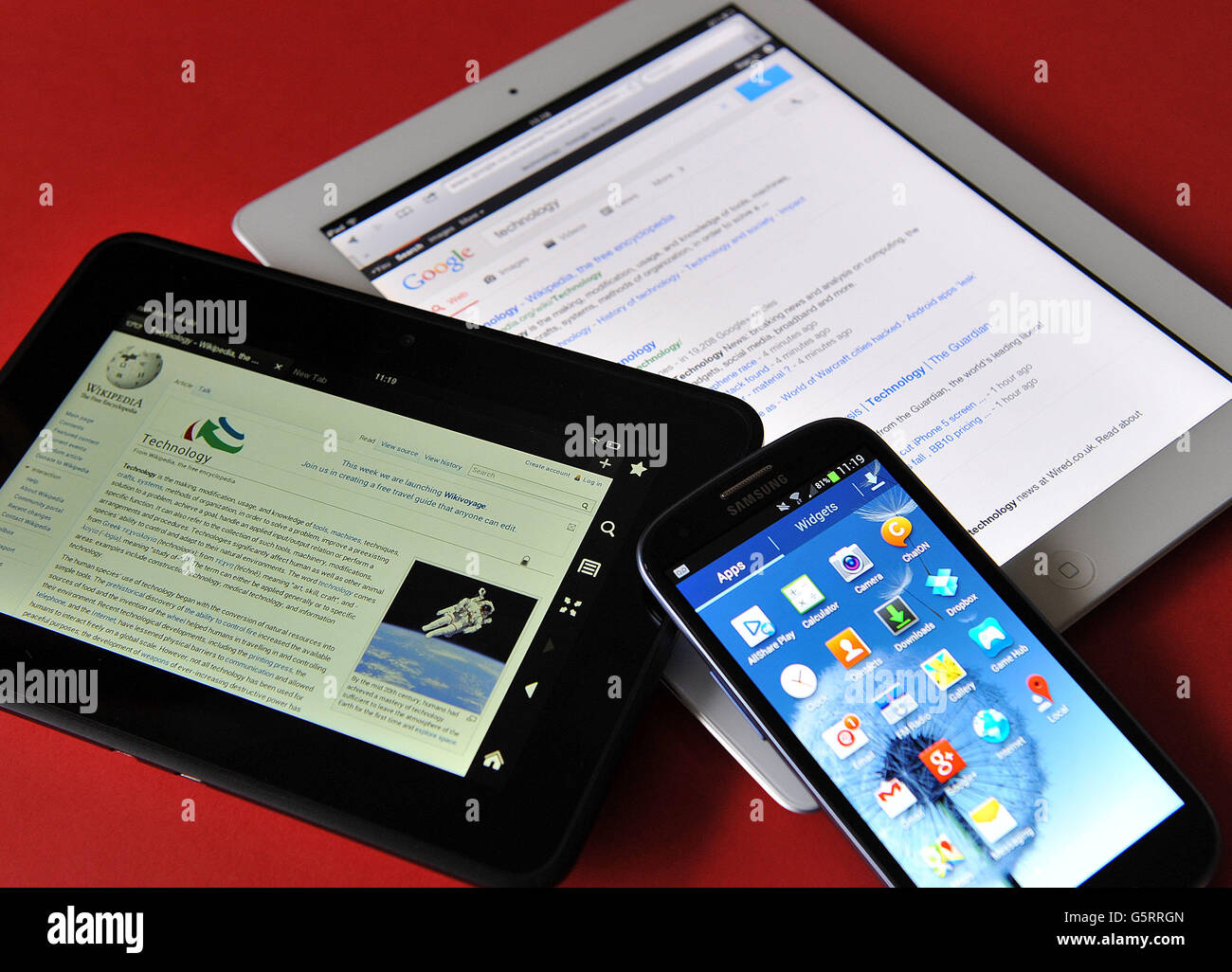 Stock photo of an Apple iPad, a Kindle HD and a Samsung Galaxy S3 android phone. Stock Photo
