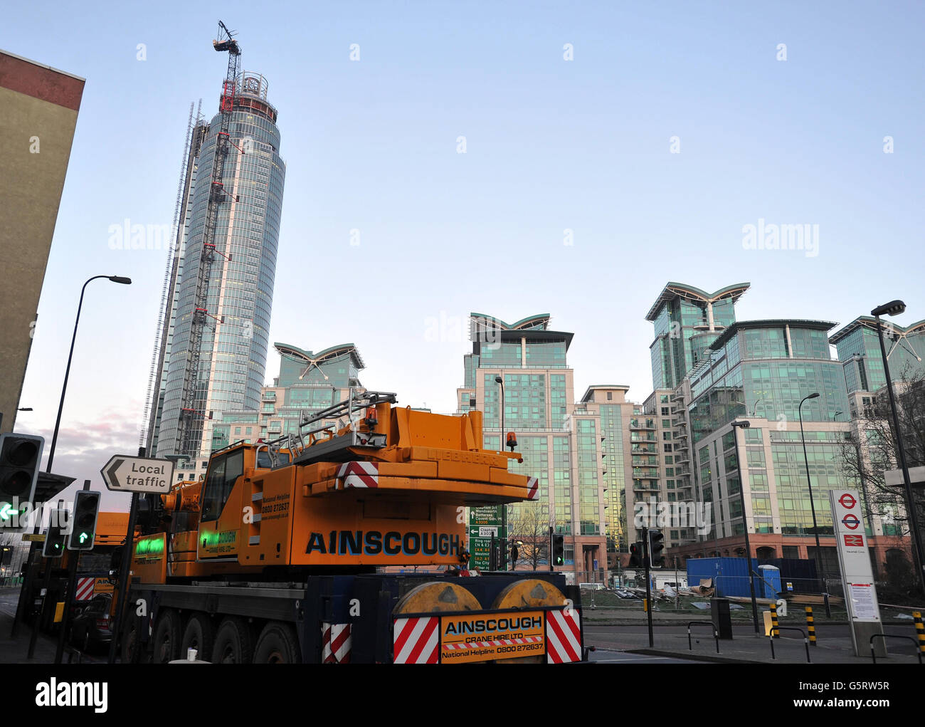 A group of heavy lifting Cranes wait near to St George's Wharf tower building, as they prepare to clear the wreckage of the Crane that was hit by a Helicopter, in Vauxhall south London. PRESS ASSOCIATION Photo. Picture date: Thursday January 17, 2013. See PA story Photo credit should read: John Stillwell/PA Wire PRESS ASSOCIATION. Stock Photo